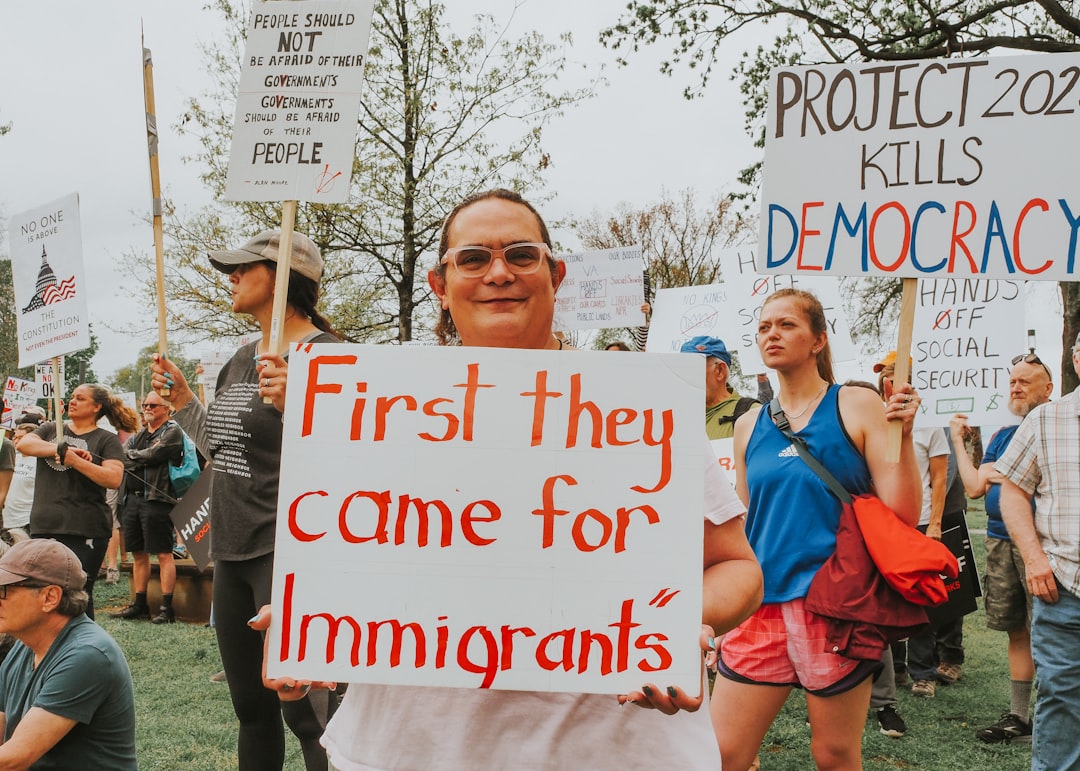creative protesters-hold-signs-about-immigrants-and-democracy-vf-mesvgabo