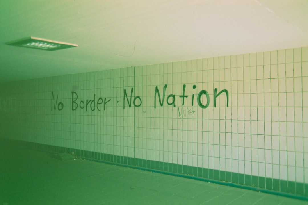 why-choose-us Urban street art graffiti quote: NO BORDER • NO NATION - political protest. Made with Leica R7 (Year: 1994) and Leica Summilux-R 1.4 50mm (Year: 1983). Homemade analog scan. Film reel: Fujicolor Velvia 50 (expired 2005)